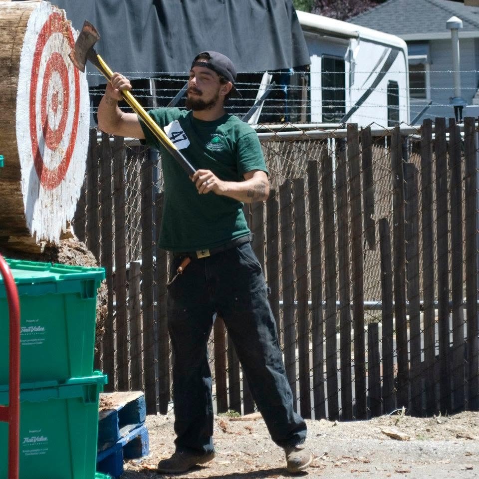 Axe chopping demonstration at an outdoor lumberjack event